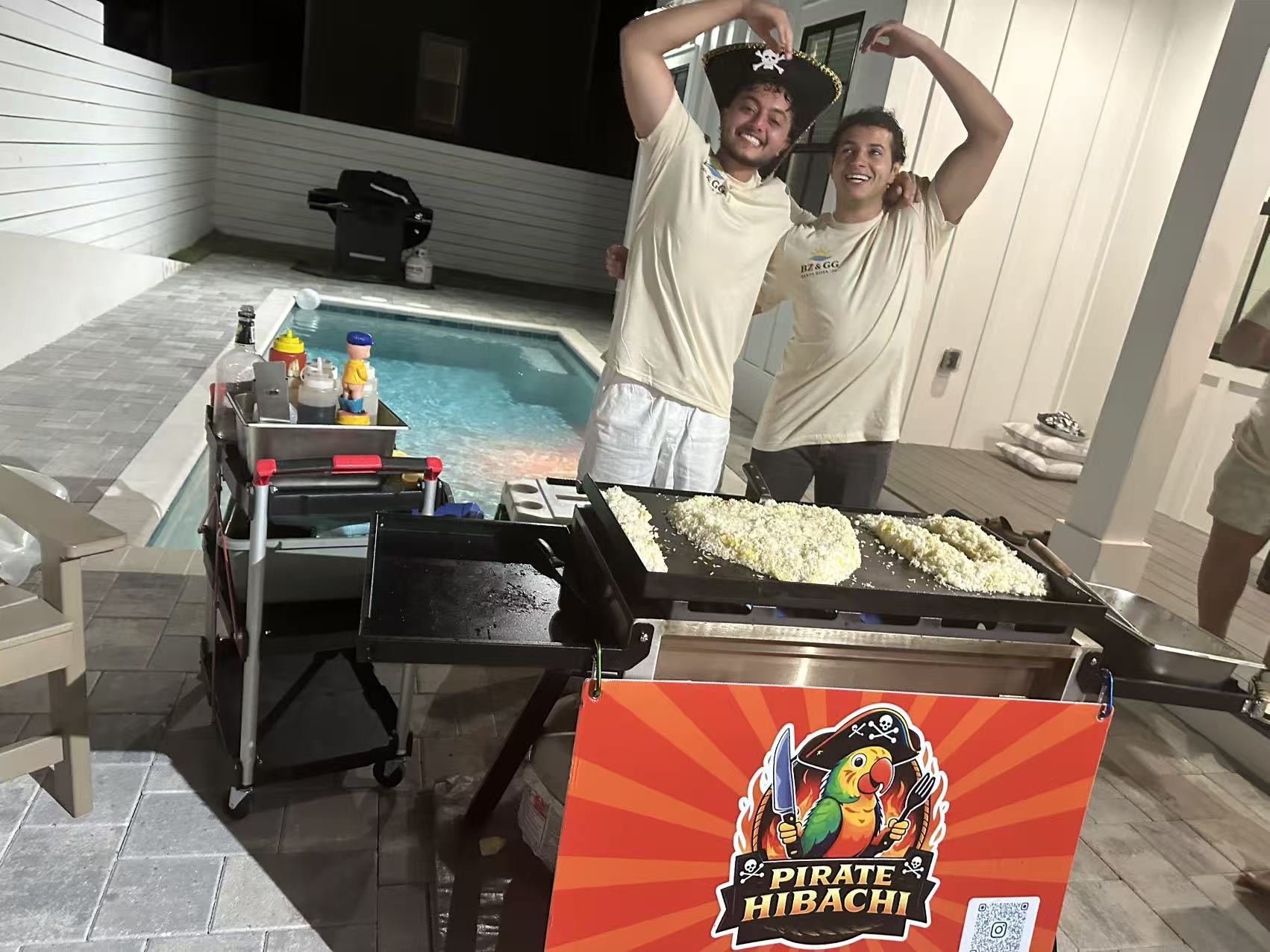 Happy family enjoying private hibachi dinner at vacation rental in 30A Florida