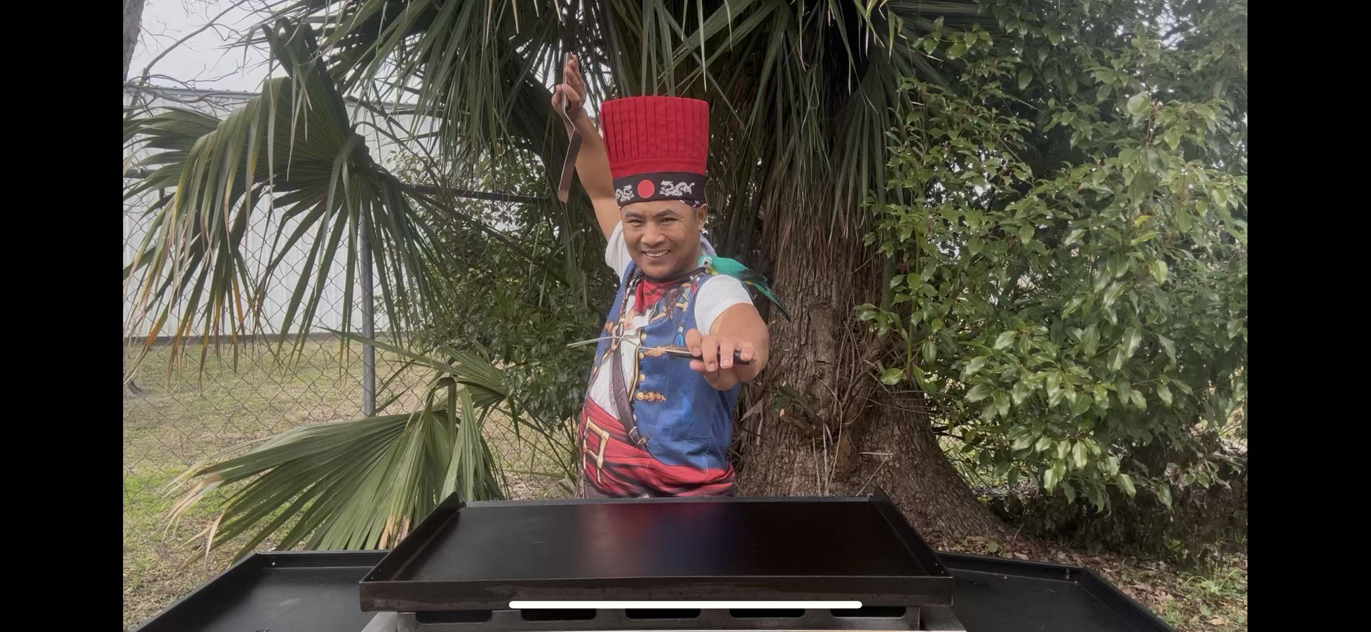 Professional hibachi chef preparing fried rice at outdoor event Destin FL